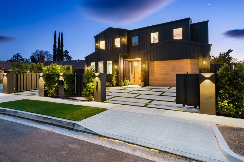 Modern luxury house exterior at dusk - EJ2 Construction Group