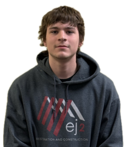 Portrait of a young man wearing a dark gray hoodie with an EJ2 Restoration & Construction logo on the chest.